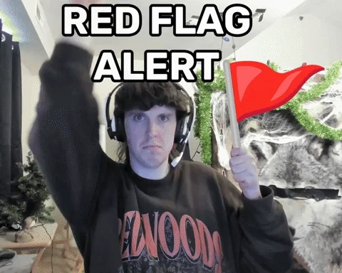 Red flag alert gesture with serious warning expression